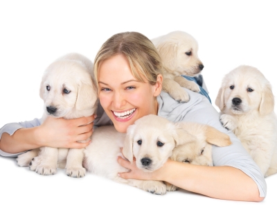 Cheerful young woman with her pet dogs
